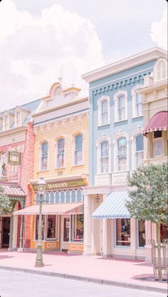 several colorful buildings line the street in front of each other