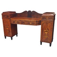 an antique wooden desk with two drawers