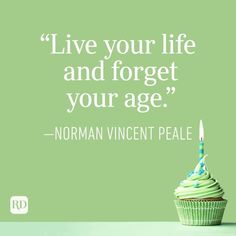 a cupcake with a lit candle on it that says live your life and forget your age