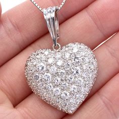 Make every day full of sparkle & romance with this dazzling large Heart Inspired Pendant Enhancer, it made of 18k gold .Featuring (65) Fiery Icy White Round Cut Diamonds, G-H color,  VS clarity. weighting in total 7.50  carats.This exquisite piece attaches to a 14k gold bale  that opens to enhance your pearl neckalce can be added to your favorite chain,***Chain is not Included**Purity marked.Remains in Pristine Condit Luxury Heart Cut Necklace With Diamond Accents, Luxury Diamond White Heart Necklace For Wedding, Luxury Wedding Heart Necklace With Diamond Accents, Luxury Heart Necklace For Wedding On Valentine's Day, Luxury Heart Necklace For Valentine's Day Wedding, Luxury Diamond White Heart Necklace With Brilliant Cut, Luxury Brilliant Cut Diamond White Heart Necklace, Dazzling Heart-shaped Diamond Cut Jewelry, Luxury Heart Necklace With Diamond Cut