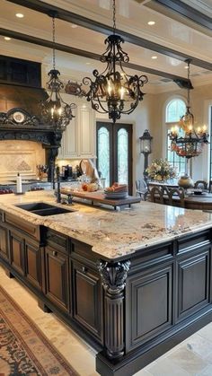 a large kitchen with an island and chandelier