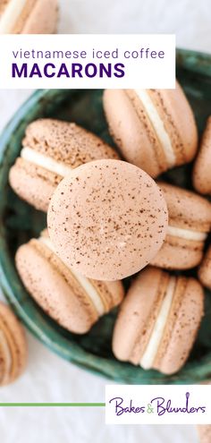 a bowl filled with macarons sitting on top of a table