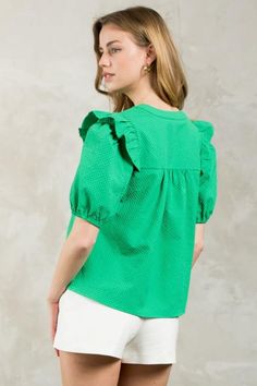 Introducing the Puff Sleeve Textured V-Neck Top in a vibrant green hue. This lightweight blouse features a split neckline and ruffle detail at the shoulder for a touch of playfulness. Its boxy fit makes it easy to tuck into your favorite trousers or pair with flare jeans. Green V-neck Top With Ruffles, Green Puff Sleeve Top With Ruffles, Green Puff Sleeve Tops With Ruffles, Trendy Green Cotton Puff Sleeve Top, Summer Green Cotton Puff Sleeve Top, Green Cotton Puff Sleeve Top For Summer, Trendy Kelly Green Tops For Spring, Trendy Green Puff Sleeve Top For Spring, Green Cotton V-neck Blouse