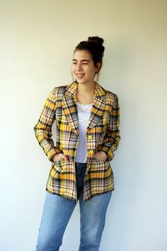 Vintage plaid jacket in yellow red black and white, button-up, fully lined in satin, side pockets, original tag intact,100% Rayon, aside from minor signs of wear, very good vintage condition, clean, ready to wear.  ** Model is 5'8" and size S/M for reference.**Approximate size: M- please refer to the measurements.M E A S U R E M E N T S -were taken with garments laying flat, please double where necessary.————————————♥————Length :28"-72cmArmpit to Armpit: 19“-49cm (buttoned)Shoulder to Shoulder: Yellow Notch Lapel Blazer For Fall, Yellow Blazer With Button Closure For Fall, Fall Yellow Blazer With Button Closure, Classic Yellow Fall Blazer, Retro Plaid Outerwear With Button Closure, Retro Plaid Button-up Outerwear, Vintage Plaid Outerwear For Office, Vintage Plaid Outerwear For Spring, Retro Button-up Fall Blazer