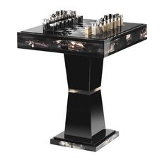 a black table with chess pieces on it