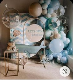 a room with balloons and decorations on the wall