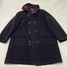 Couple Defects. Pictured. Holes Near Seams. Hooded Outerwear With Toggle Closure For Work, Winter Outerwear With Toggle Closure For Cold Weather, Hooded Blue Outerwear With Buttons, Classic Winter Outerwear With Toggle Closure, Blue Hooded Outerwear With Buttons, Wool Outerwear With Toggle Closure For Winter, Winter Wool Outerwear With Toggle Closure, Casual Outerwear With Toggle Closure For Cold Weather, Fall Navy Hooded Jacket With Detachable Hood