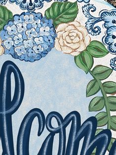 a blue and white plate with flowers on it that says mom written in cursive writing