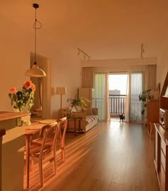 a living room filled with furniture and a wooden floor