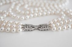 "This beautiful 3 strand pearl necklace has been inspired by the late Queen Elizebeth II. Queen Elizebeth II was mostly seen wearing her signature three-strand pearl necklace which she incorporated into her outfits for public engagements.   The royal family has a long custom of wearing pearls not only for regality and special occasions, but also daily for a simple yet classy elegance. Pearls have always been a symbol of natural feminine power, beauty, and strength. This beautiful 3 strand knotted pearl necklace is certain to be a favourite for any occasion. Knotting pearls is a traditional method of beading. The knots protect pearls from rubbing against each other and to keep them from flying everywhere if the strands break.  What makes these crystal pearls so special? Preciosa crystal pea Classic Multi-strand Pearl Necklace For Wedding, Elegant Multi-strand Pearl Necklace For Formal Occasions, Elegant Wedding Jewelry With Clasp Detail, Knotting Pearls, Wearing Pearls, Classic Pearl Necklace, Luxury Christmas Gifts, Vintage Inspired Jewelry, Christmas Gift For Her