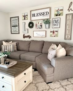 a living room filled with lots of furniture and pictures on the wall above it's coffee table