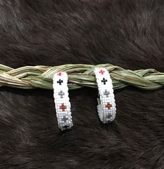 Authentic Beautiful Native American Indian Jewelry Navajo Zuni Hand Beaded with Seed Beads 1 1/2 inch Hoop Earrings Great for a  Gift❤️ Handcrafted by Navajo Artist Harriet Crosby Present in virtually every Native American tribe, the feather symbol is universally recognized as a representation of trust, strength, wisdom, freedom, and honor. Incorporated into many sacred pieces of Native American wear, the feather is easily one of the most respected symbols. Southwestern Style Beaded Dangle Hoop Earrings, Traditional White Hoop Earrings, Adjustable White Hoop Earrings For Festivals, Southwestern Jewelry With Round Beads For Pierced Ears, Traditional Small Hoop Beaded Jewelry, Traditional Beaded Hoop Jewelry, Southwestern Adjustable Hoop Jewelry, White Round Bead Southwestern Earrings, Southwestern Beaded Hoop Earrings