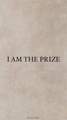 the words i am the prize are written in black on a beige background, with an old