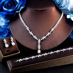 Be the queen of the party with this stunning Cubic Zirconia Necklace Set. Perfect for prom and bridal weddings, this set features a beautiful flower charm that adds a touch of elegance and glamour to your special day. 
– This bridal a plus cubic zirconia gemstone necklace set is perfect for adding elegance to any bridal ensemble.– Made with high-quality materials, this set includes a stunning necklace and matching earrings for a complete look.– Perfect for pageant, bridal, bridesmaid, prom, quin Party Queen, Zirconia Necklace, Diamond Alternatives, Cubic Zirconia Necklace, Cubic Zirconia Jewelry, Stunning Necklace, Stunning Jewellery, A Plus, Flower Charm