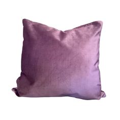 a purple pillow on a white background