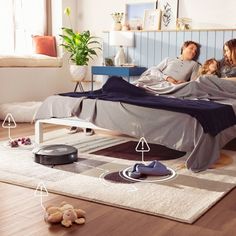 a man and woman laying on a bed with an air pug in the middle