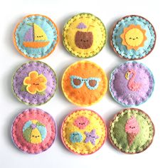 nine decorated cookies with different designs on them