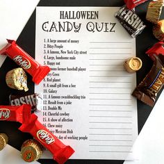 a halloween candy quiz is shown on a table with candies and chocolates around it