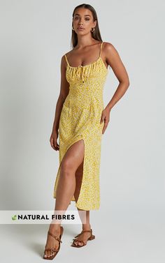 Get ready to turn heads in the Willa Midi Dress - Ruched Bust Thigh Split Dress In Yellow Floral! This stunning yellow dress features a charming sweetheart neckline and a figure-flattering fitted silhouette that is perfect for any occasion. With its sleeveless design and comfortable cotton fabric, this slip dress is not only stylish but also incredibly easy to wear. The thigh-high split adds an extra touch of sass, while the midi length keeps it classy. Whether you're going for a casual day look Yellow Midi-length Dress With Fitted Bodice, Yellow Midi Dress With Fitted Bodice, Yellow Fitted Bodice Midi Dress, Yellow Fitted Dress With Sweetheart Neckline, Flirty Ruched Square Neck Midi Dress, Fitted Sundress With Ruched Bodice And Sweetheart Neckline, Yellow Dress With Sweetheart Neckline And Fitted Bodice, Ruched Dress With Sweetheart Neckline For Brunch, Sweetheart Neckline Ruched Dress For Brunch