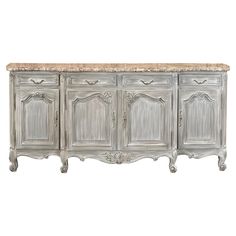 an antique style sideboard with marble top in grey and beige tones, on a white background