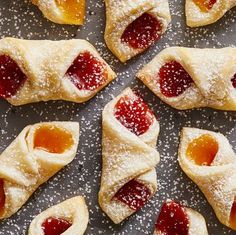 small pastries with jelly filling on a baking sheet