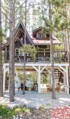 a house in the woods surrounded by trees