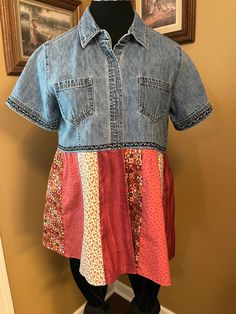 This is a repurposed lightweight denim top with a group of blended pink and green calico fabrics for the bottom portion of the tunic top.  It has a pretty black and white scrolled grosgrain ribbon trim.  It gives a light feminine touch to the tunic top.  It can be worn with leggings or capris for a casual boho, hippie look or Western style. It is in a new recycled condition, please review the photos.  We hand crafted the top locally in the Middle Georgia area of the United States.  In our Boutique's workshop. The shirt that was recycled is a At Last Classics brand. The size of the top on the tag is a size Medium.  I have added measurements so that you can check the fit.  Please see below before ordering. The flat armpit to armpit measurement is about 20" and 40" all the way around. The bac Denim Blue Patchwork Denim Top, Fitted Denim Tops With Patchwork, Fitted Denim Patchwork Tops, Casual Summer Patchwork Denim Top, Casual Patchwork Denim Top For Summer, Casual Summer Denim Patchwork Top, Blue Cotton Denim Top With Patchwork, Blue Patchwork Cotton Denim Top, Blue Cotton Patchwork Denim Top