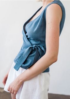 Blue Linen V-neck Blouse, Cotton Wrap Top For Summer, Summer Cotton V-neck Wrap Top, Casual Linen Wrap Top, Casual Linen Wrap Top For Summer, Chic Cotton Wrap Top For Summer, Fitted Sleeveless Wrap Top For Spring, Fitted Sleeveless Wrap Top Casual, Casual Cotton Wrap Top