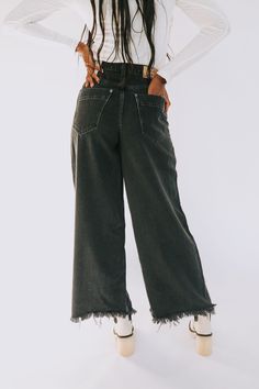 Details High-rise Exaggerated wide-leg fit Raw bottom hem Five-pocket style Button-front closure Denim jeans Sizing Approximate measurements: SIZE LENGTH INSEAM WAIST 24 40" 29" 24" 25 41" 30" 25" 26 41" 30" 26" 27 41.5" 30" 27" 28 42" 30.5" 28" 29 42.5" 31" 29" 30 42.5" 31" 30" 31 43" 31.5" 32" 32" 43" 31.5" 34" Fits true to size Fabric has little to no stretch Models are 5'10 wearing 26 and 5’11” wearing 28 Material 60% Cotton 40% LyocellMachine wash cold separatelyOnly non-chlorine bleachTumb Everyday Fall Pants With Frayed Hem, Chic Dark Wash Wide Leg Jeans, Wide Leg Jeans In Washed Black With Belt Loops, Chic Wide Leg Flare Jeans In Washed Black, Chic High Waist Flare Jeans In Washed Black, Chic Wide Leg Washed Black Flare Jeans, Fall Washed Wide Leg Cropped Jeans, Everyday Wide Leg Washed Black Pants, Wide Leg Washed Black Pants For Everyday