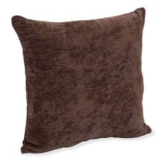 a brown velvet pillow on a white background