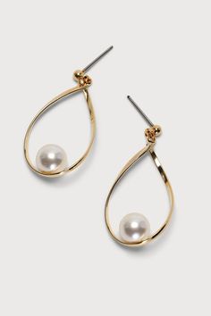 You won't have to dive to depths of the ocean to capture the beauty of the Lulus Truly a Treasure Gold Pearl Teardrop Earrings! These dainty gold-toned teardrop-shaped hoop earrings are adorned with a faux pearl focal. Post backs. 1. 25" Long. 80% Brass, 20% Acrylic. Imported. Lulus | Truly a Treasure Gold Pearl Teardrop Earrings. Wedding Earrings Gold, Treasure Gold, Gold Teardrop Earrings, Pearl Teardrop Earrings, Teardrop Earrings Gold, Earrings With Pearls, Classy Earrings, Gold Earrings Wedding, Wedding Day Gifts