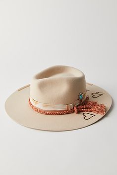 *The* perfect finish to add to absolutely any ‘fit, this effortlessly essential hat is featured in a wide brimmed silhouette and staple felt fabrication with branding, braided rope, and turquoise-adorned charm for the ideal western-inspired touch. | Roundtop Brimmed Felt Hat by Mossant at Free People in Tan