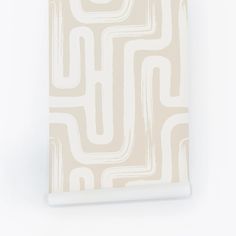 a white and beige wallpaper with an abstract design on the front, along with a light colored background