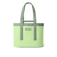 the yeti tote bag is light green and has grey trims on it