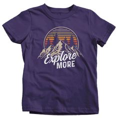 "Kids Hiking T Shirt Hiker Shirt Explore More Mountains Shirt Hiker Gift Camping Tee Mountains Shirt Boy's Girl's Youth Get there when you do! Hiking can be so freeing. This t shirt is perfect for any hiker or camper. It features vintage colors, a mountain range and distressed fonts. It simply reads 'Explore More'. Made of soft, ring spun cotton. Includes a drawstring cotton gift bag. Direct to garment printed using the latest technology. Soft, ring spun cotton. Please check out my other Etsy It Graphic Print Cotton Top For Outdoor Activities, Outdoor Slogan Crew Neck Top, Outdoor Slogan Tops With Crew Neck, Cotton Tops With Front Print For Outdoor Activities, Adventure Graphic Cotton Tee, Adventure Graphic Cotton Tee Shirt, Outdoor Short Sleeve Slogan Tops, Graphic Tee Shirt With Letter Print For Outdoor Activities, Short Sleeve Letter Print Shirt For Hiking