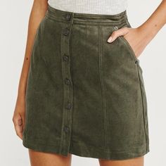 Abercrombie Green Suede Button-Down Mini Skirt. Lightly Worn, Great Condition. Xxs Fall High Waist Mini Skirt With Buttons, Fall High-waist Mini Skirt With Buttons, Fall Mini Skort With Button Closure, Fitted Skirt With Snap Buttons For Fall, Casual Button-up Lined Mini Skirt, Casual Button-up Fall Skirt, Casual Green Buttoned Skirt, Trendy Buttoned Mini Skirt For Winter, Casual Mini Skirt With Buttons