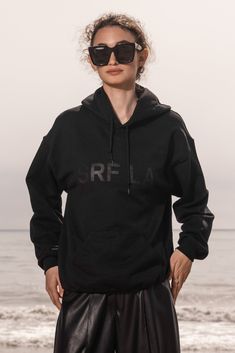 CLASSIC SRF LA HOODIE Pocket Draw String Hoodie Wear it oversized! These are unisex adult sizes, all kids are wearing size medium Model is 5'11 wearing size S Made in California Fabric : pre-shrunk 50/50 cotton/polyester Care : Machine Wash Hoodie Pocket, Black On Black, All Kids, 50 50, Kids Wear, Timeless Pieces, Black Hoodie, Kangaroo Pocket, Drop Shoulder