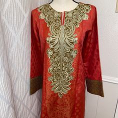 Pakistani Three Piece Suit.Brand Limelight.Shirt Fabric Is Jacquard Have Beautiful Embroidery.Color Peach.Brand New.Excellent For Eid And Dewali Sz M.Sz Approx Bust 21”.Waist 20” Hip 23” Length 44” Trouser 38” Elegant Festive Jacquard Embroidered Fabric, Festive Elegant Jacquard Embroidered Fabric, Semi-stitched Long Sleeve Salwar Kameez With Gold Embroidery, Festive Salwar Kameez With Gold Embroidery And Long Sleeves, Bollywood Style Salwar Kameez With Gold Embroidery, Traditional Long Sleeve Salwar Kameez With Gold Embroidery, Festive Long Sleeve Salwar Kameez With Gold Embroidery, Formal Salwar Kameez With Intricate Embroidery And Long Sleeves, Elegant Tunic Salwar Kameez With Resham Embroidery