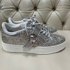 Beautiful Brand New Jimmy Choo Silver Sneakers Made Of Leather And Covered In Glitter With Gems, Size 38 Or 7.5, Made In Italy, I No Longer Have A Box. Everything In My Closet Is Authentic And Pm Will Authenticate It For You For Free, Enjoy! Luxury Embellished Lace-up Sneakers, Leather Sneakers With Glitter Accents And Round Toe, Low-top Leather Sneakers With Glitter Accents, Embellished Leather Sneakers With Round Toe, Low-top Leather Glitter Sneakers, Embellished Leather Sneakers, Silver Embellished Low-top Sneakers, Silver Embellished Sneakers With Round Toe, Embellished Low-top Party Sneakers