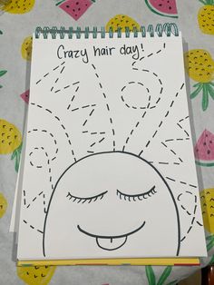 a notebook with the words crazy hair day written on it