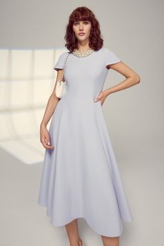 Stunning fit and flare dress made with our signature high quality Italian wool crepe in a lupin blue, lilac shade. The hem hits at mid calf and has beautiful fluid movement whilst remaining full and structured. A centre back zip allows for step-in ease, and the dress is fully lined in silk satin. The detachable Embellished Pearl Bead Collarette is sold separately, and is available to purchase online or in our London boutique. Pairs beautifully with our Hunter Coat in Lupin Blue. --- - Outer: Ita Suzannah London, Dresses For The Races, Fluid Movement, London Boutique, Formal Dresses With Sleeves, Wool Crepe, Blue Lilac, Ladies Clothes, Vintage Couture