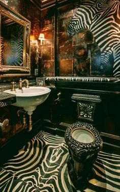 a bathroom with zebra print flooring and walls