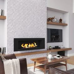 a living room filled with furniture and a fire place in the middle of the wall