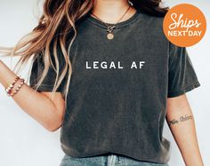 Make a bold statement with our 'Legal AF' shirt, ideal for law professionals and those celebrating their legal milestones. For a smooth and hassle-free transaction, please read the entire listing, FAQs, policies, and shop announcement. Thank you!💛 MATERIAL This shirt is made of premium quality cotton/polyester blend for a great quality soft feel, and comfortable retail fit. PRINT APPLICATION We use water-based eco-friendly ink for our print designs. CARE INSTRUCTIONS * Machine wash inside-out u Girlfriend Shirts, Reading Shirts, Book Shirts, Roller Derby, Gymnast, Teacher Shirts, Mom Shirts, Softball, Funny Shirts