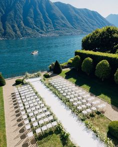 an aerial view of a wedding set up by the water