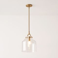 a clear glass light fixture hanging from a ceiling