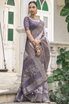 Immerse yourself in the world of elegant and traditional world by wearing this light purple silk saree which will make your look very subtle yet edgy.This square neck and half sleeve blouse is woven zari work.It is completed with a silk lightweight saree in light purple color accentuated with printed and woven zari work.This blouse can be customized up to the maximum size available in inches 44 around the bust. Slight color variation may occur due to photographic reasons. Velvet Suit Design, Anarkali Suits Bollywood, Frock Style, Purple Saree, Bollywood Dress, Orange Saree, Yellow Saree, Black Saree, Green Saree