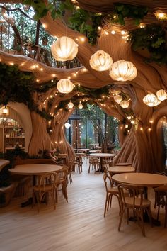 a restaurant with wooden tables and chairs covered in paper lanterns hanging from the ceiling above them