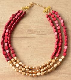 A lightweight beaded multi strand statement necklace made with gold and dark red wood beads. - 3 strands- Shortest strand measures 18.5-20.5" long- Beads measure 10mm- Lobster claw clasp is gold stainless steel (gold filled, stainless steel and sterling silver are also available)- Connector is lead free pewter- 2" stainless steel extender chain The necklace length and number of strands can be customized.Larger quantities may be available. We use the highest quality findings to ensure a piece tha Silver Jewelry Box, Chunky Statement Necklace, Red Wood, Gold Statement Necklace, Wood Necklace, Gold Wood, Multi Strand, Necklace Length, Wood Beads