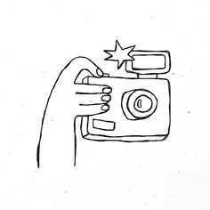 a drawing of a camera being held up by someone's hand with one thumb on it